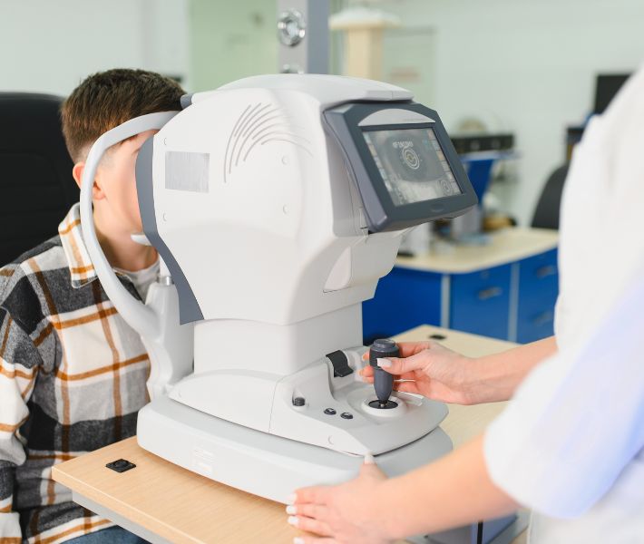 optometrist measuring axial length in child to track effectiveness of myopia management
