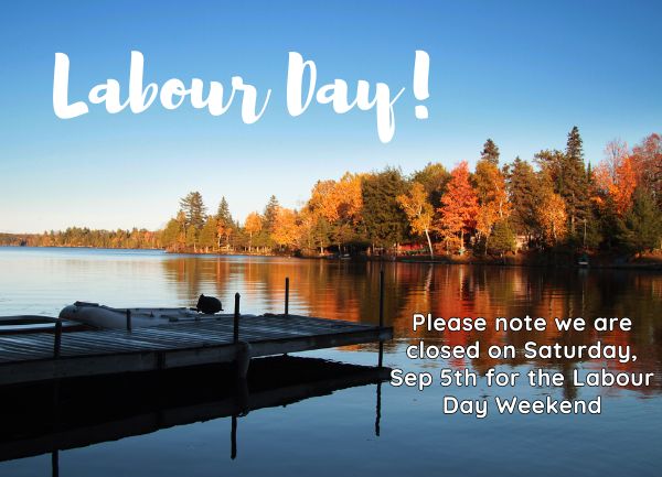 A calm lake with a dock, surrounded by autumn trees. Text: Labour Day! Please note we are closed on Saturday, Sep 5th for the Labour Day Weekend.
